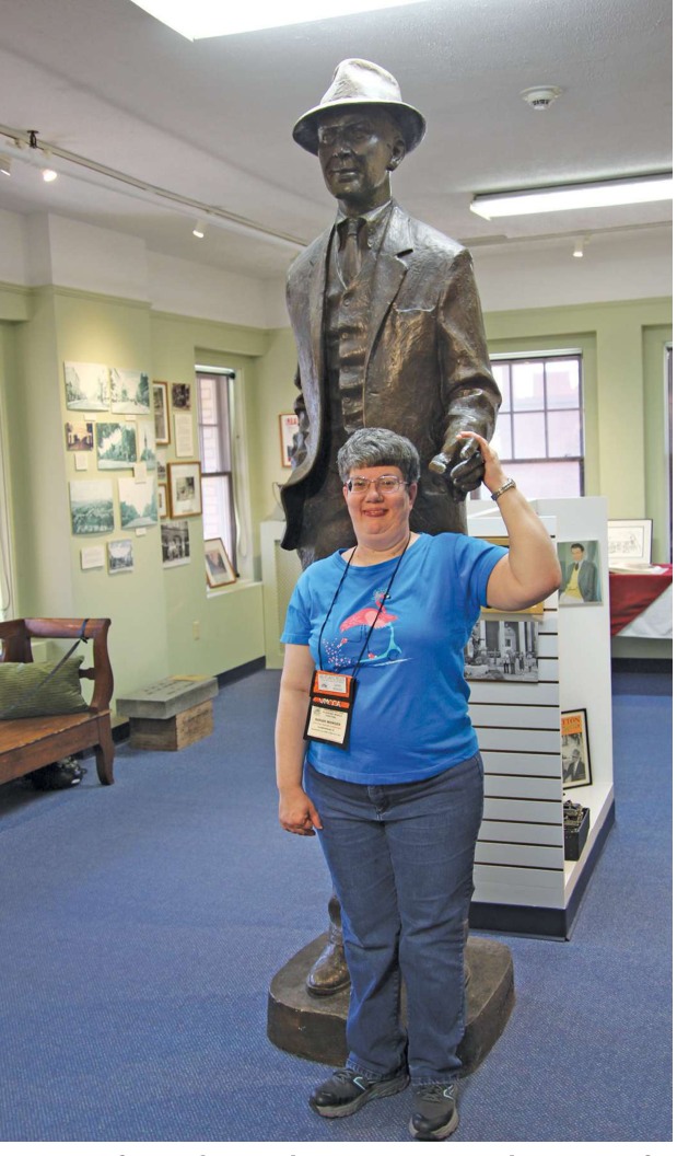 Sarah Wenger poses with a statue of Jimmy Stewart.